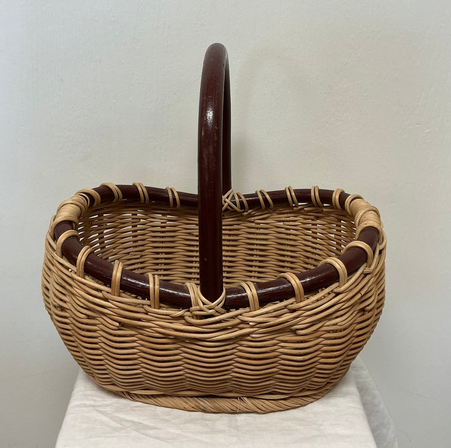 VINTAGE RATTAN BASKET WITH BAMBOO HANDLE