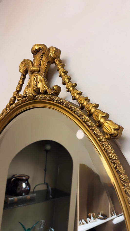 Round Giltwood Wall Mirror with Decorative Crest